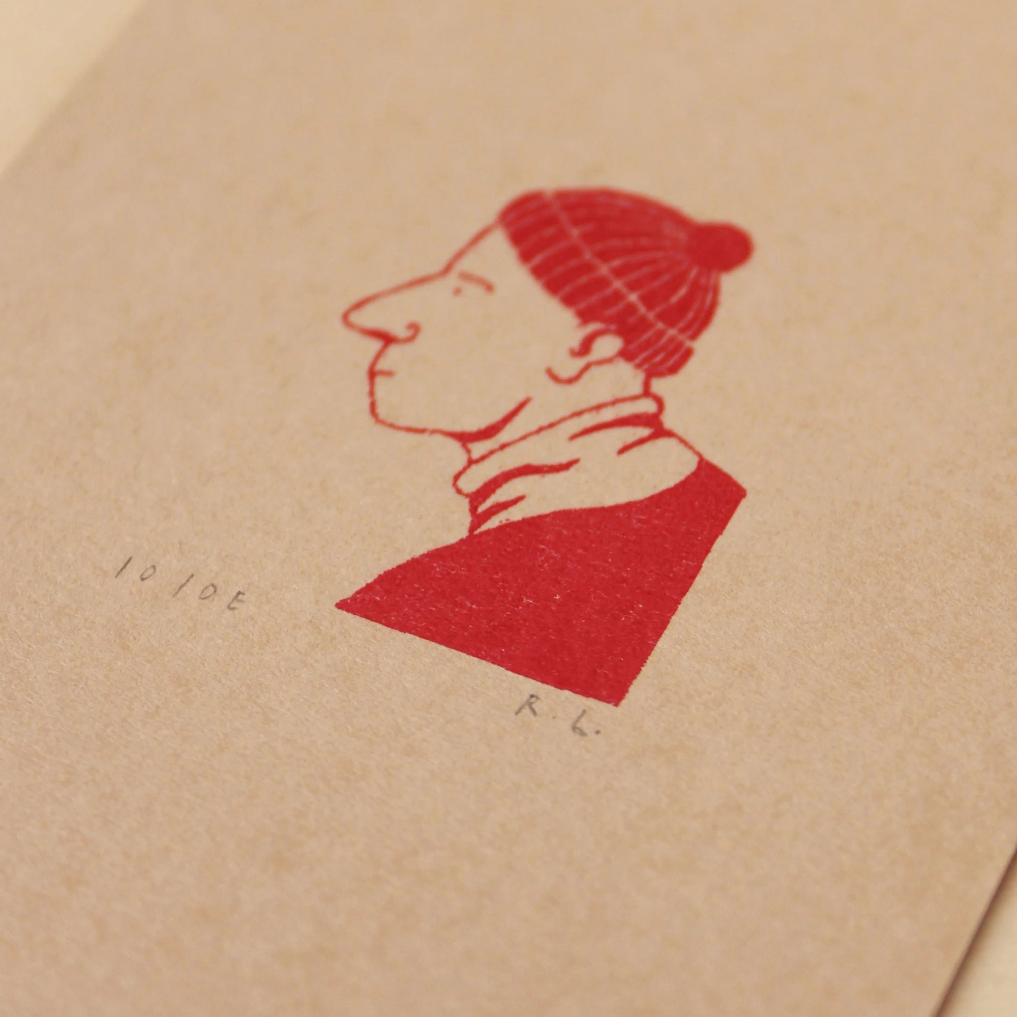 Red ink silhouette of a person on beige paper
