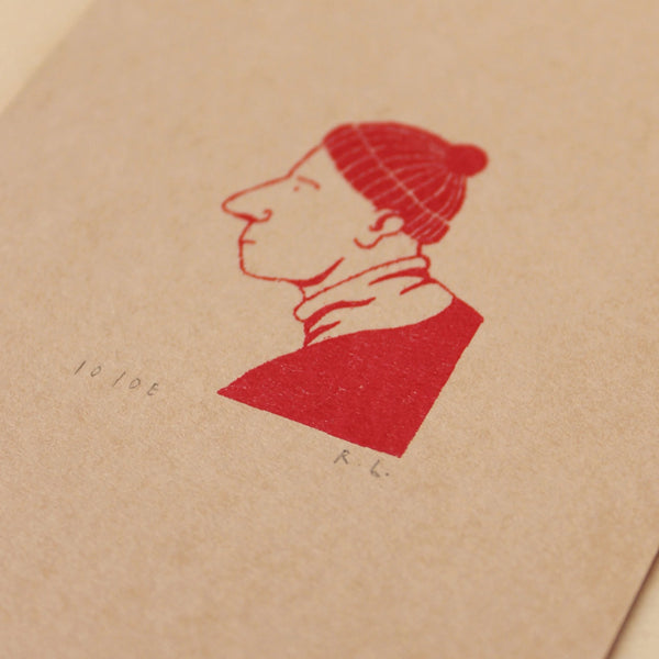 Red ink silhouette of a person on beige paper