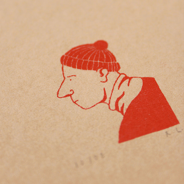 A close-up of a textured beige paper surface with a red hand-drawn illustration of a person in profile wearing a knit beanie and a high-neck top. Faint numbers and the initials 'R.