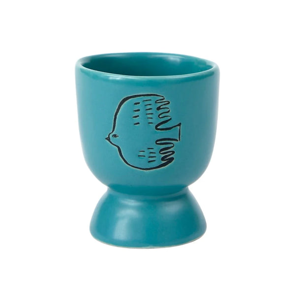 ceramic blue teal egg cup with a bird illustration drawing with a white background