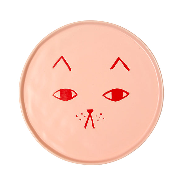 Round pink Donna Wilson side plate with red cat face design on a white background
