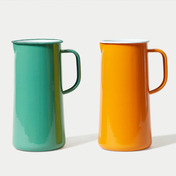 An Orange tangerine and a Spring Green Teal falconware enamel jug  a white background