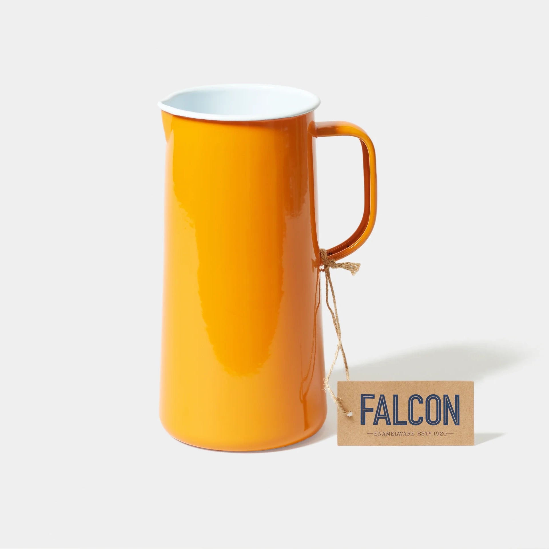 Orange tangerine falconware enamel jug  a white background