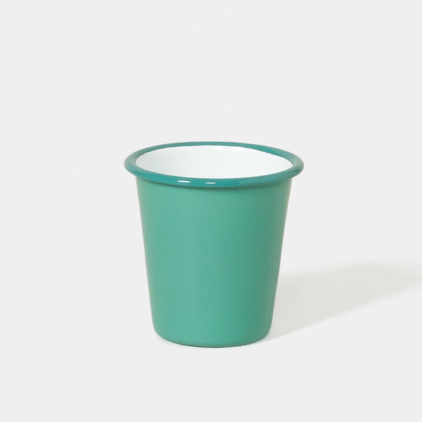 A teal enamel tumbler on a white background 