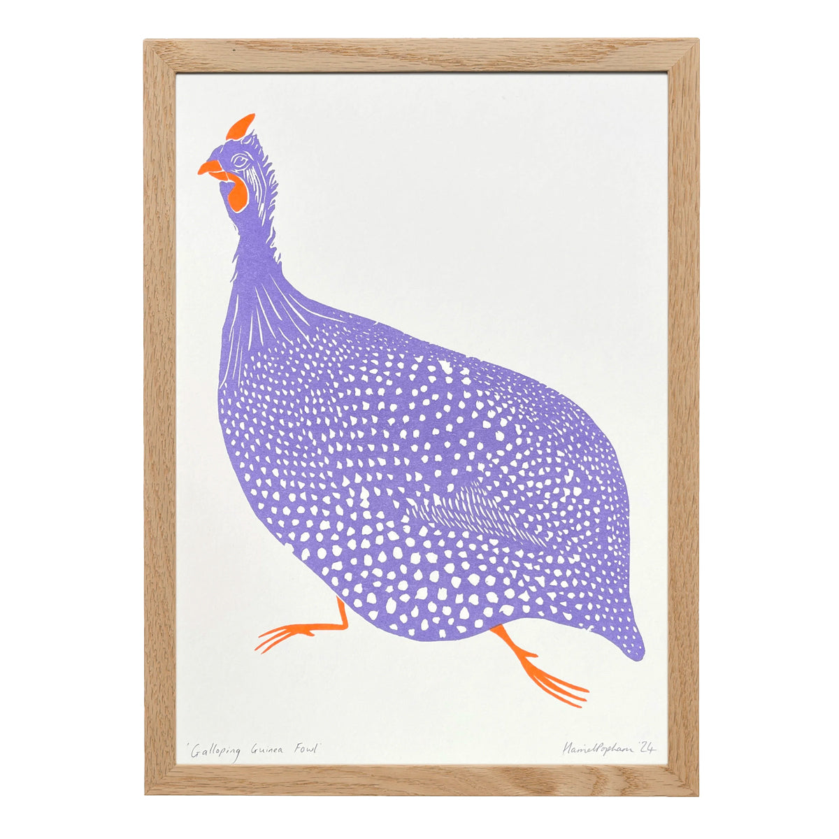 A framed art print featuring a stylized purple and white spotted guniea fowl with orange accents, set in a light natural wood frame against a white background.