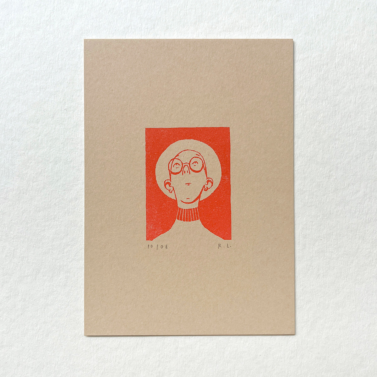 A minimalist art print on textured beige paper featuring a stylized illustration of a person with glasses and a panama hat inside a red square, set against a white textured background.
