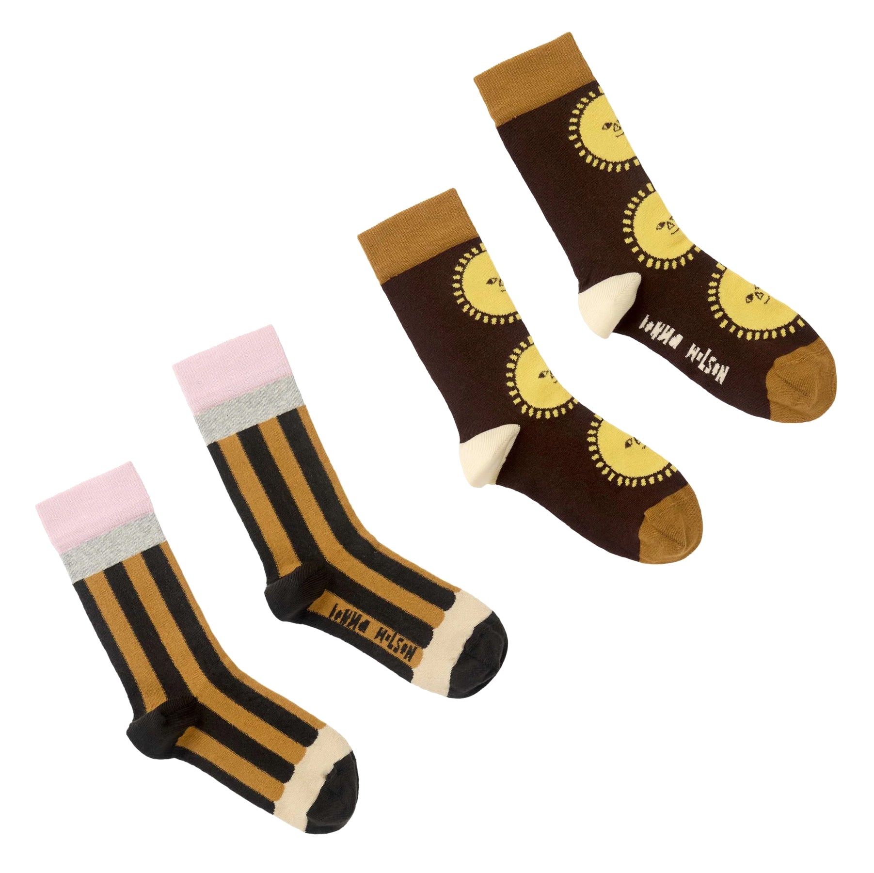 Two pairs of socks arranged on a white background: one pair are tan and black vertically striped with light pink and light gray cuffs and black toes/heels to look like a pencil. The other pair is dark brown with yellow sun motifs, cream heels, and tan toes. 