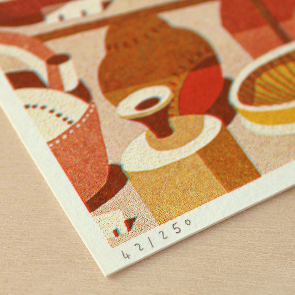 Close-up of a vintage-style illustration with geometric shapes and patterns on a textured surface.