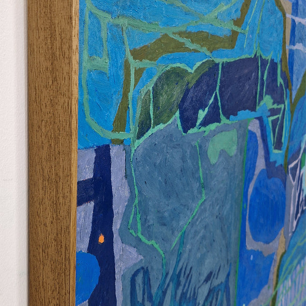 Close-up of an abstract painting featuring textured brushstrokes in shades of blue, navy, green, and gray, bordered by a light brown wooden frame against a white wall.