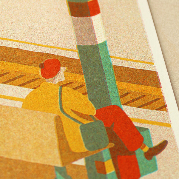 Colourful illustration of a person wearing a red beret sat on a bench at a railway station. 